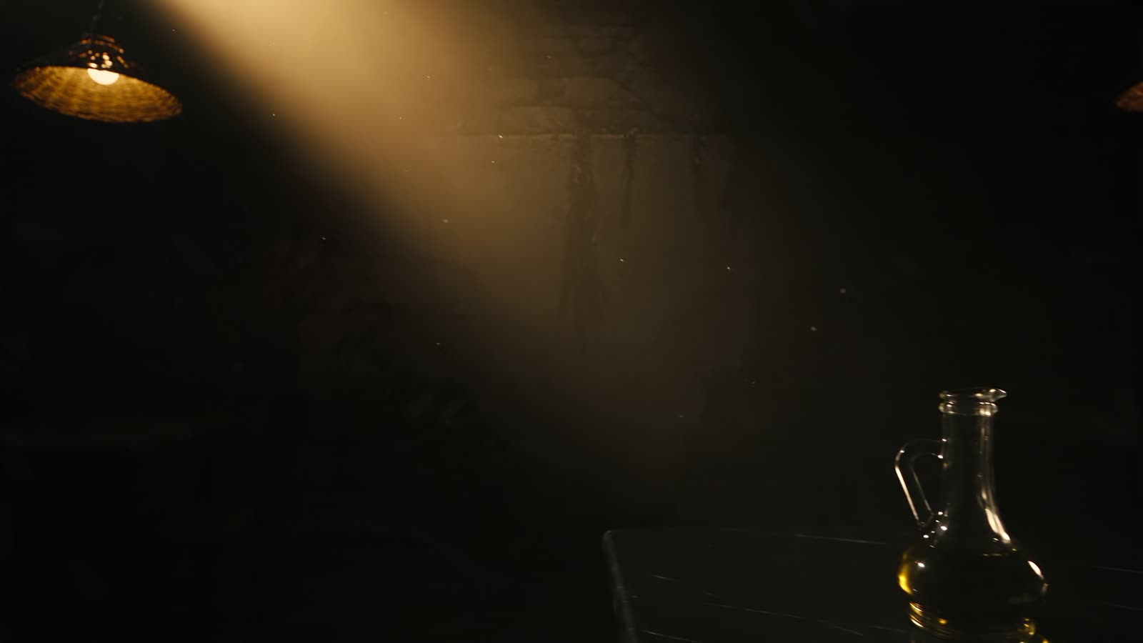 Warm light falling across a dark taverna table